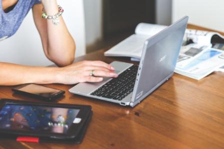 woman typing on keyboard